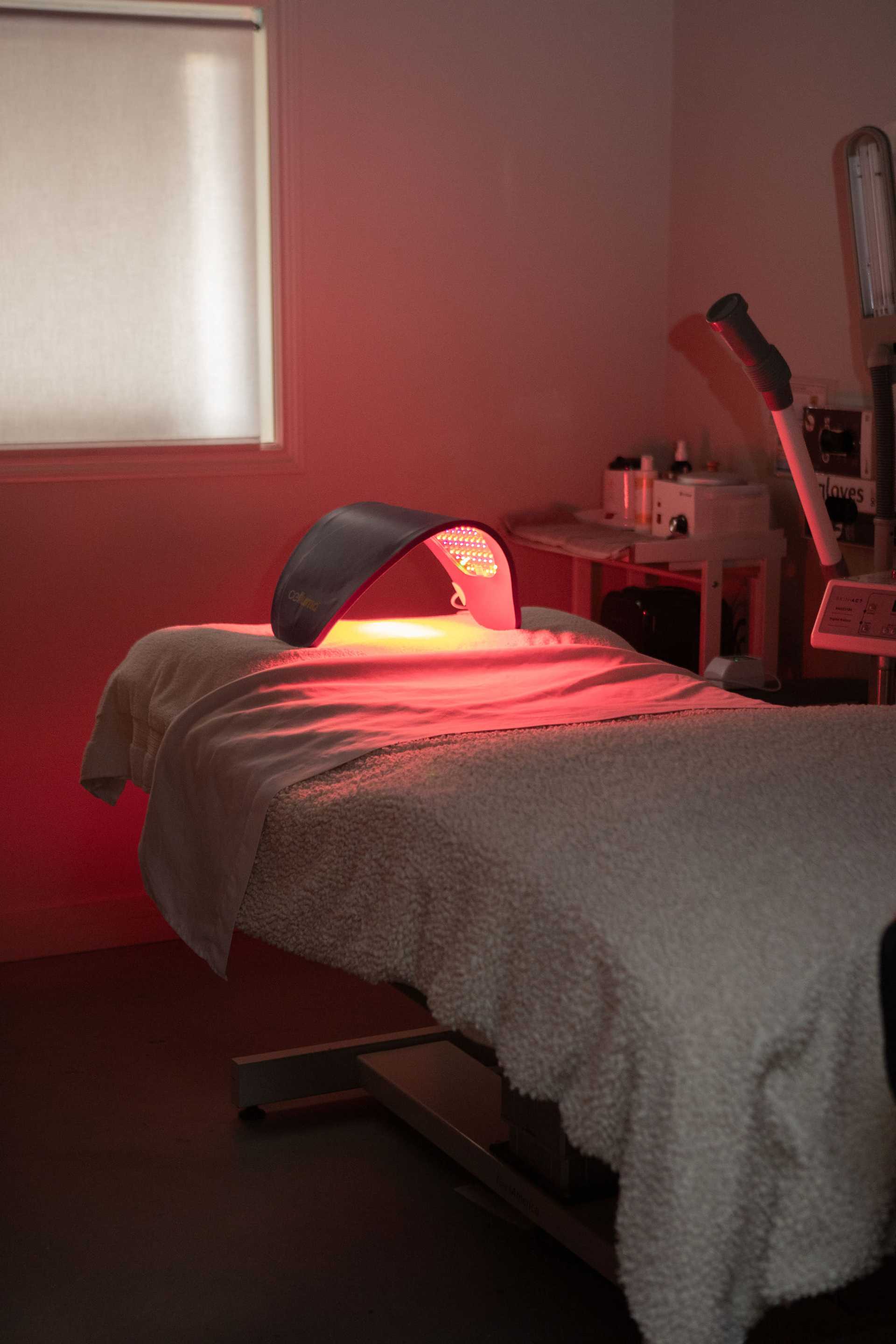 LED light therapy setup in a dimly lit treatment room.