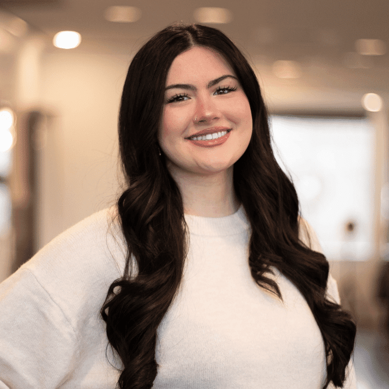 Portrait of Mazzie, a professional stylist at Brassfields Salon and Day Spa, showcasing their expertise and style.