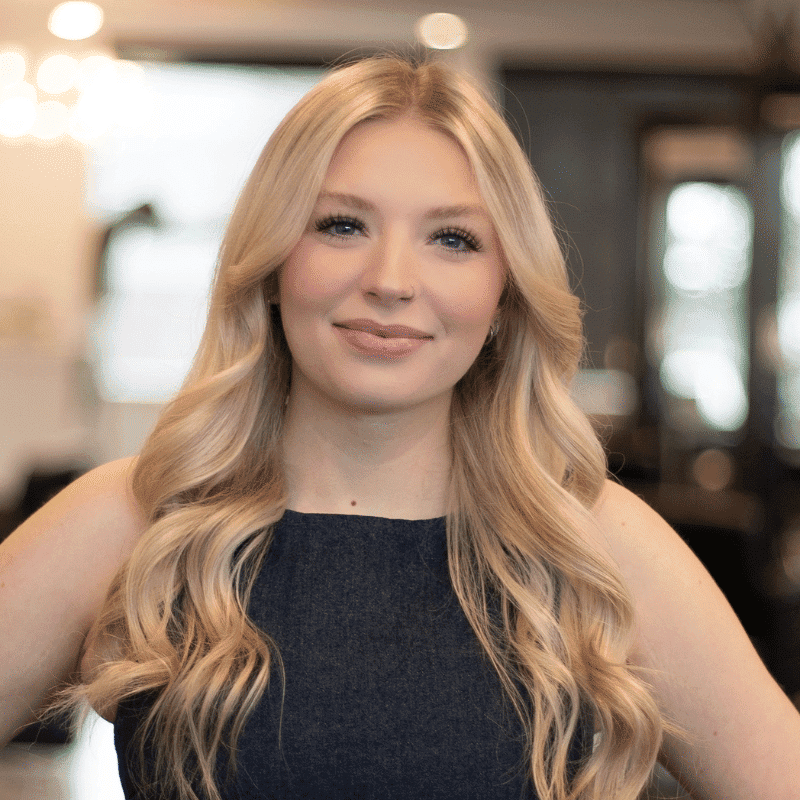 Portrait of Anna, a professional stylist at Brassfields Salon and Day Spa, showcasing their expertise and style.