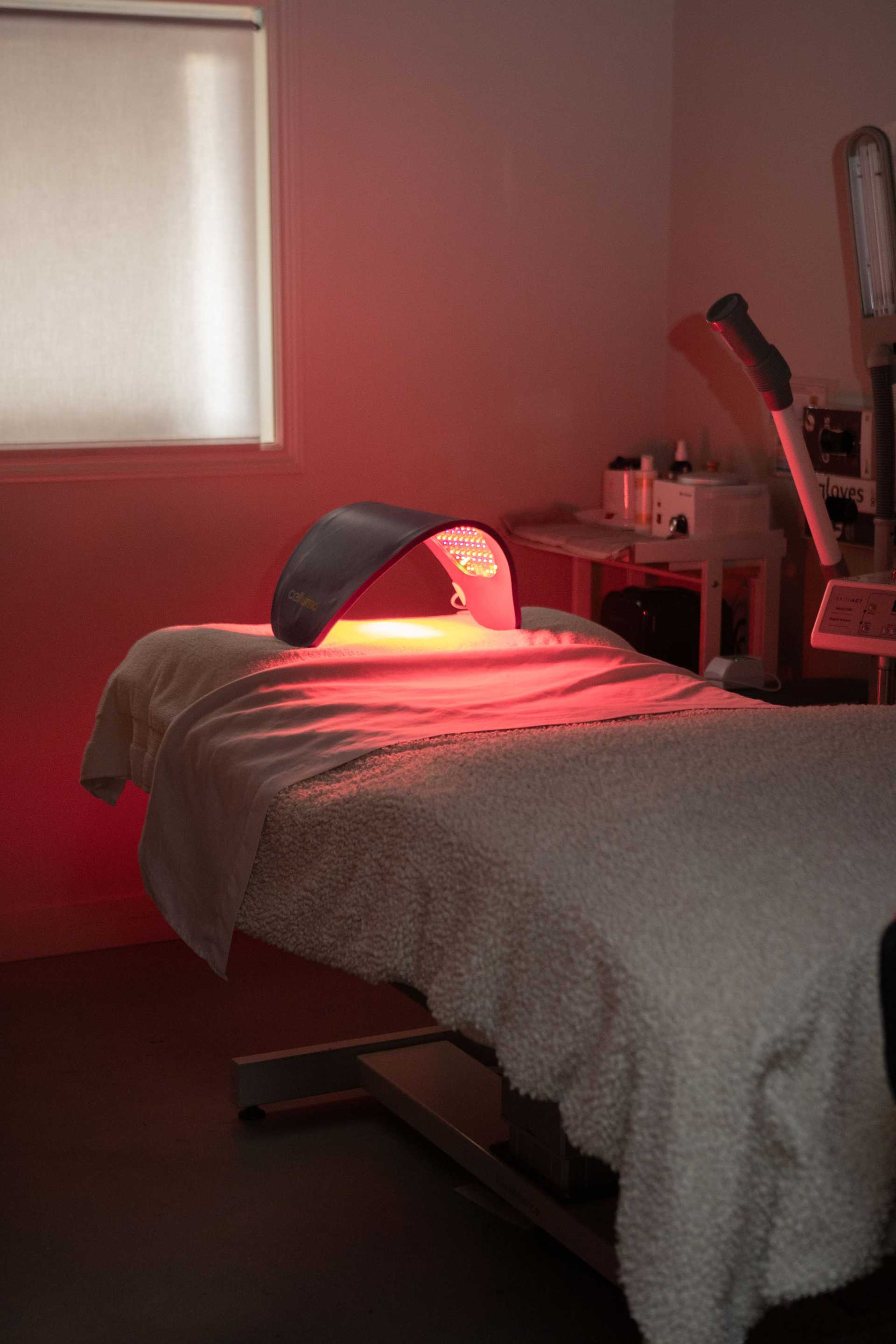 LED light therapy setup in a dimly lit treatment room.