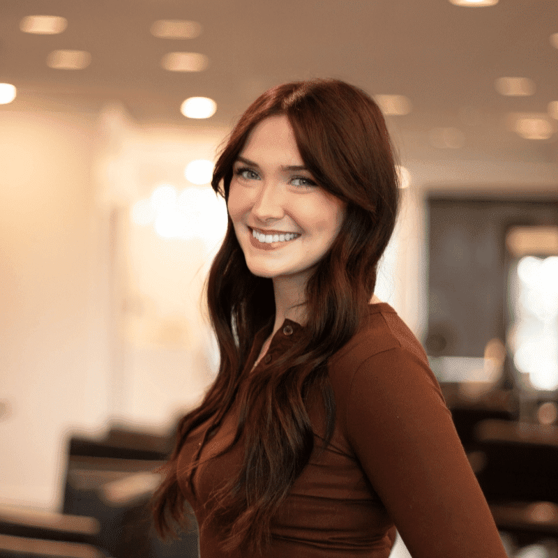 Portrait of Bree, a professional stylist at Brassfields Salon and Day Spa, showcasing their expertise and style.