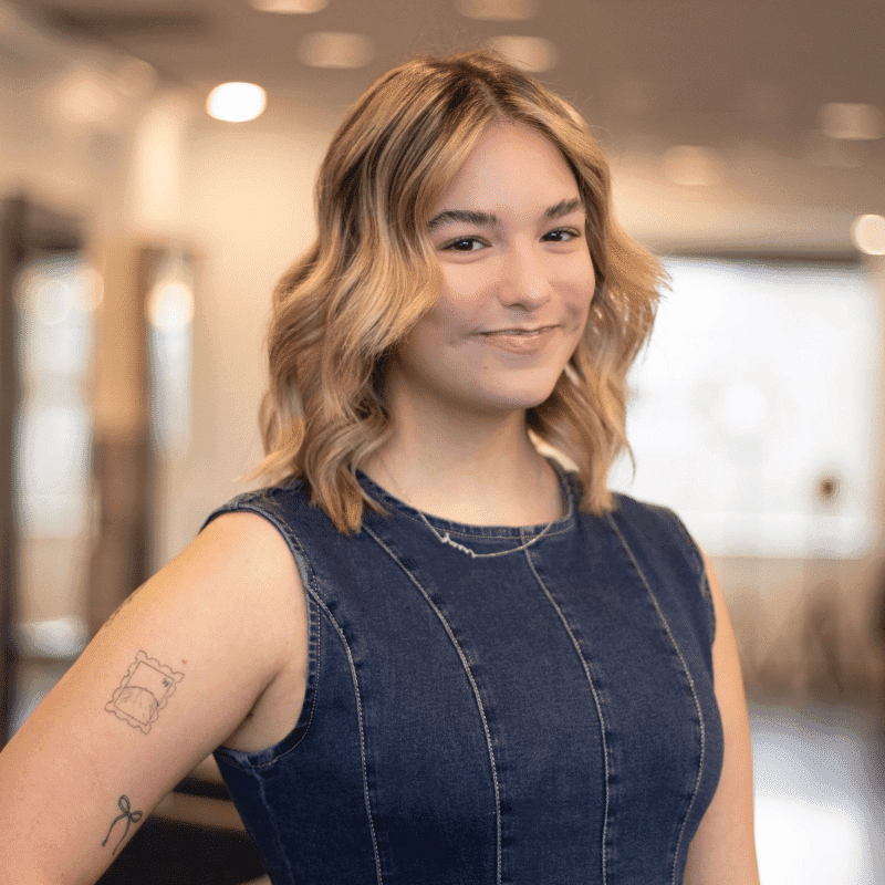 Portrait of Gwen, a professional stylist at Brassfields Salon and Day Spa, showcasing their expertise and style.