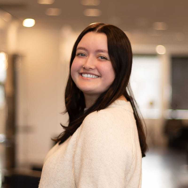 Portrait of Rylee, a professional stylist at Brassfields Salon and Day Spa, showcasing their expertise and style.