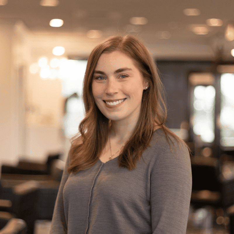 Portrait of Andrea, a professional stylist at Brassfields Salon and Day Spa, showcasing their expertise and style.