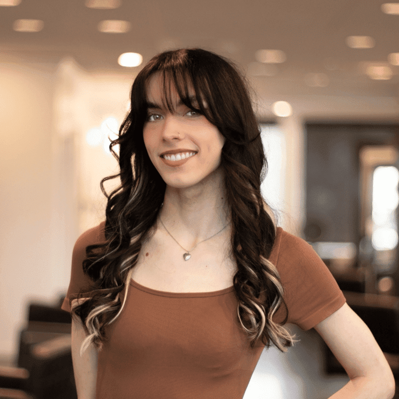 Portrait of Jade, a professional stylist at Brassfields Salon and Day Spa, showcasing their expertise and style.