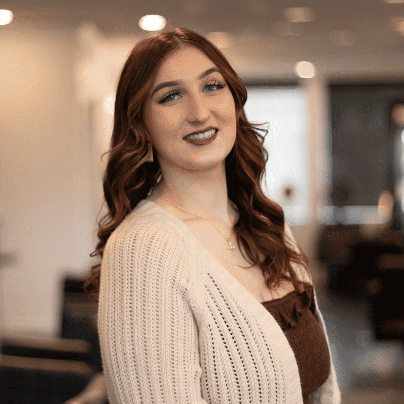 Portrait of Felicity, a professional stylist at Brassfields Salon and Day Spa, showcasing their expertise and style.