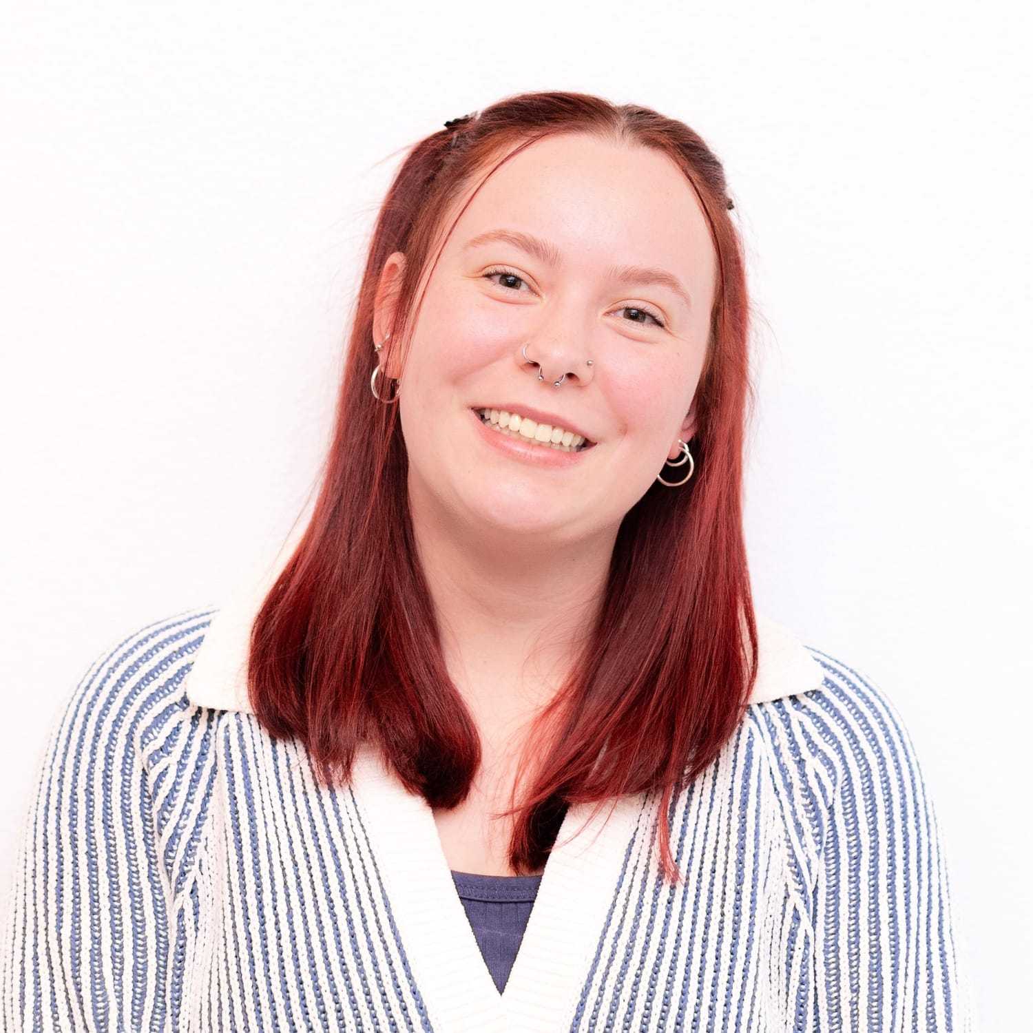 Portrait of Emma, a professional stylist at Brassfields Salon and Day Spa, showcasing their expertise and style.