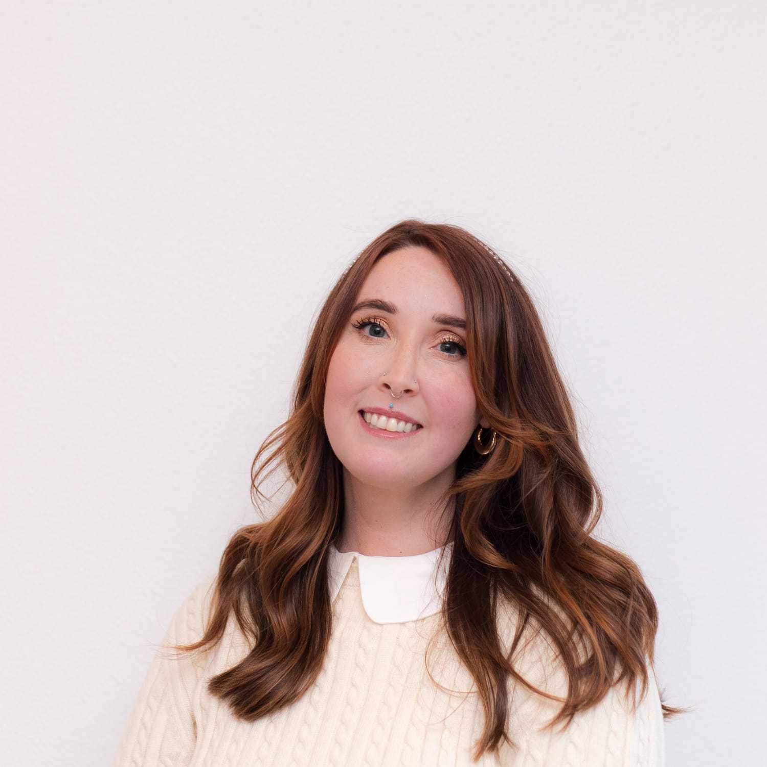 Portrait of Chrissa, a professional stylist at Brassfields Salon and Day Spa, showcasing their expertise and style.
