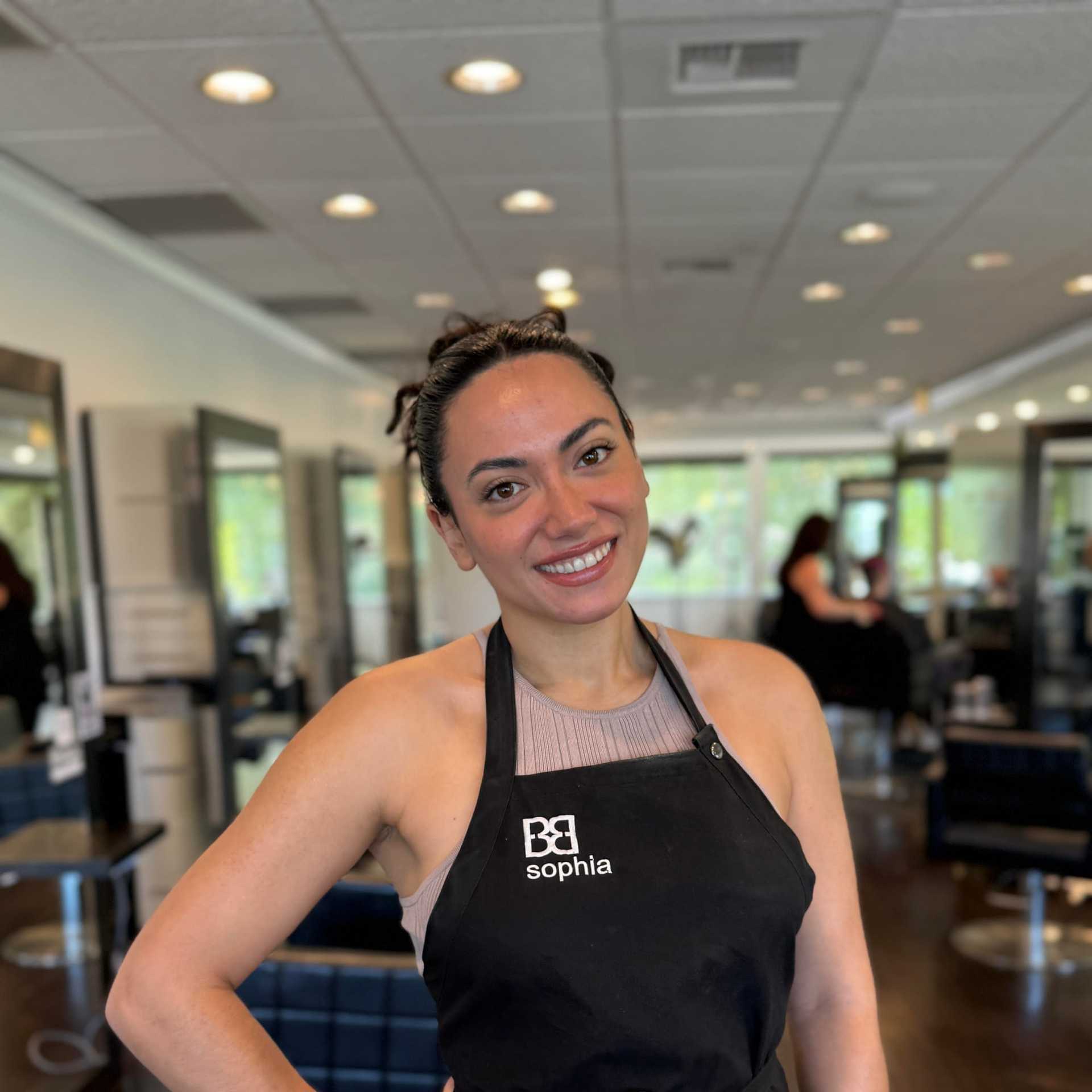 Portrait of Sophia, a professional stylist at Brassfields Salon and Day Spa, showcasing their expertise and style.