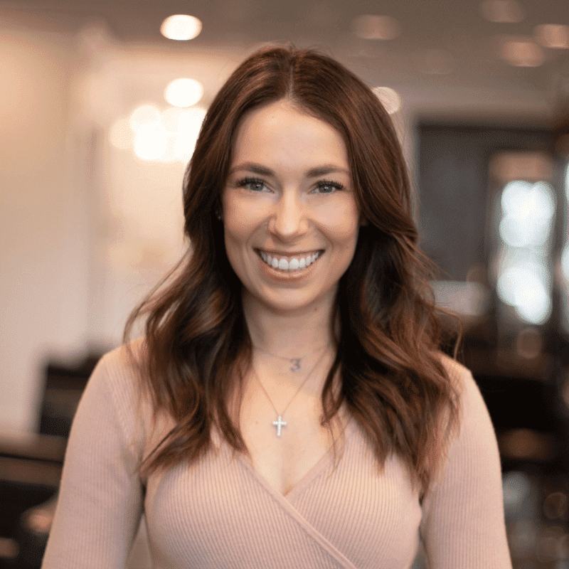 Portrait of Brittany, a professional stylist at Brassfields Salon and Day Spa, showcasing their expertise and style.